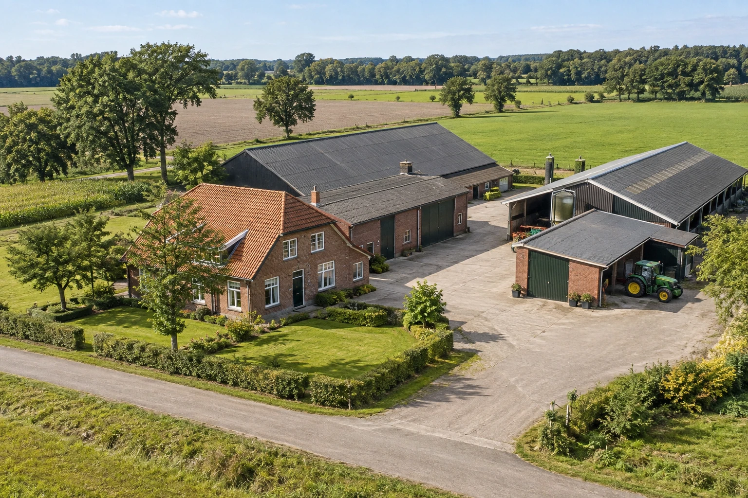 Farm with a brick farmhouse, agricultural buildings, yard and adjoining fields